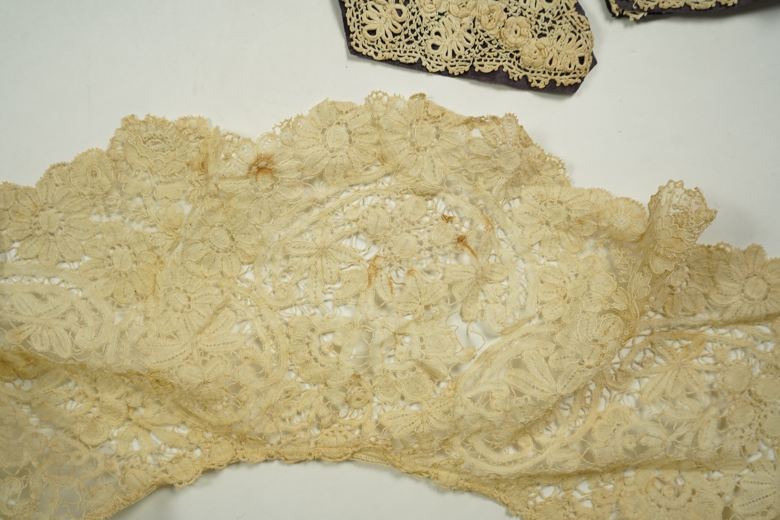 A mixed Brussels bobbin lace and Point de Gaze lace collar, another smaller collar, a similar length of trim and butterfly motif, together with a Brussels bobbin collar and trim, an Irish crochet cuffs, a Valenciennes la